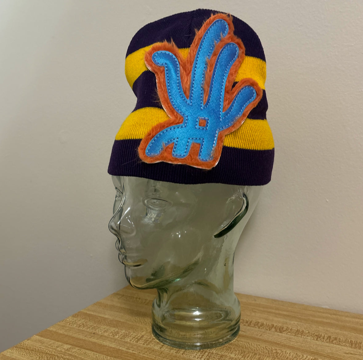 east/ west striped beanie