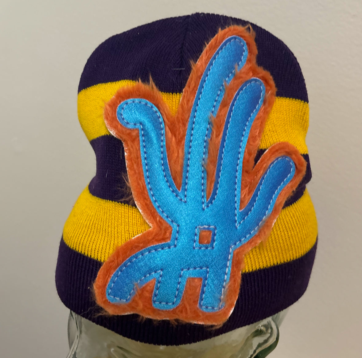 east/ west striped beanie